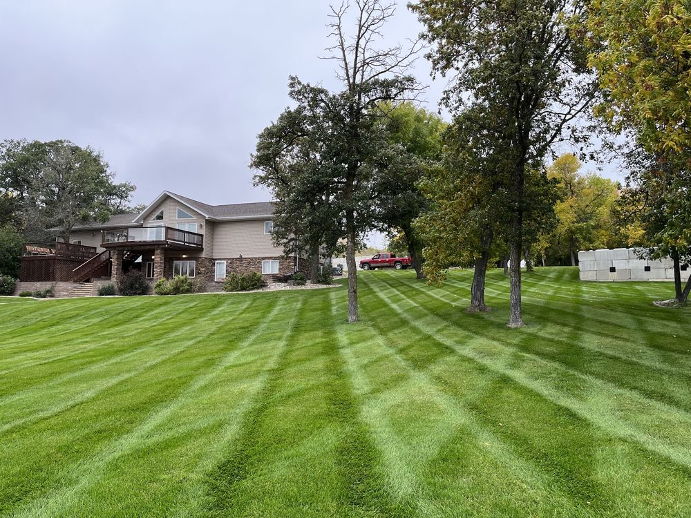 Lake home with a freshly striped lawn
