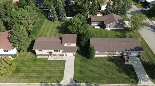 Aerial view of freshly striped lawns on neighboring town lots